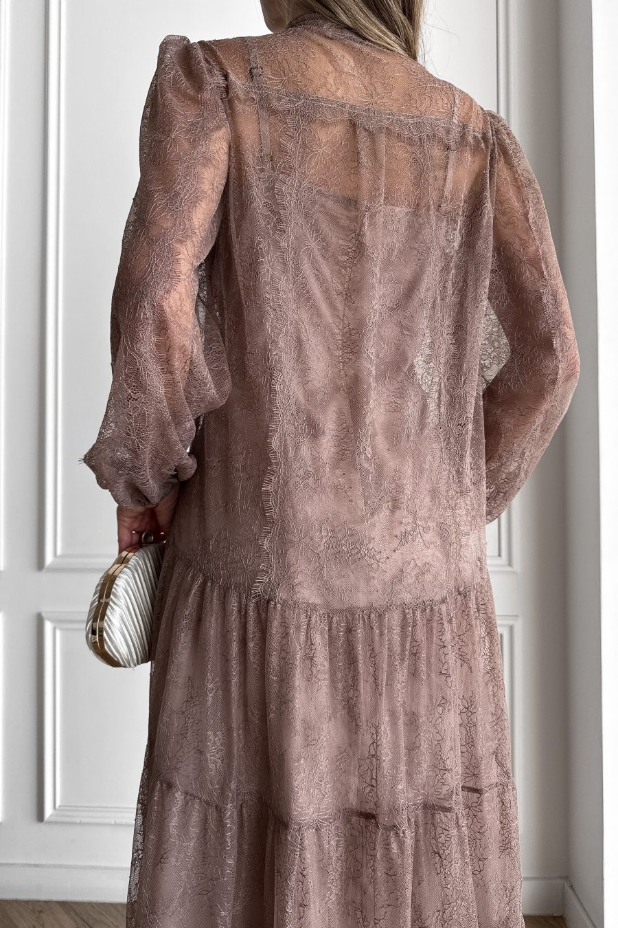 Lace long dress of a free silhouette, with a beige dress cover on straps