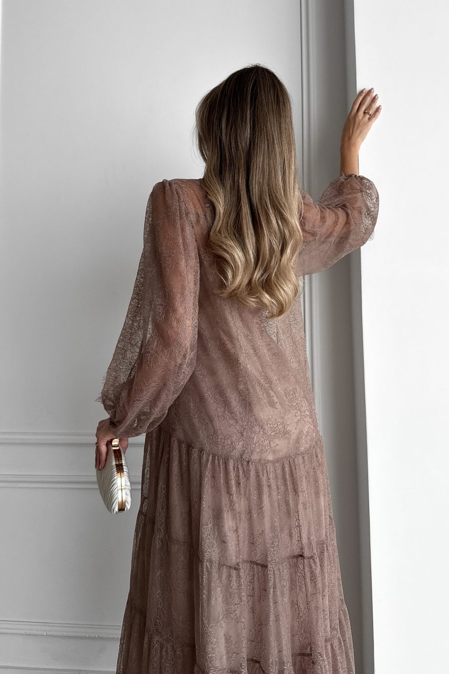 Lace long dress of a free silhouette, with a beige dress cover on straps