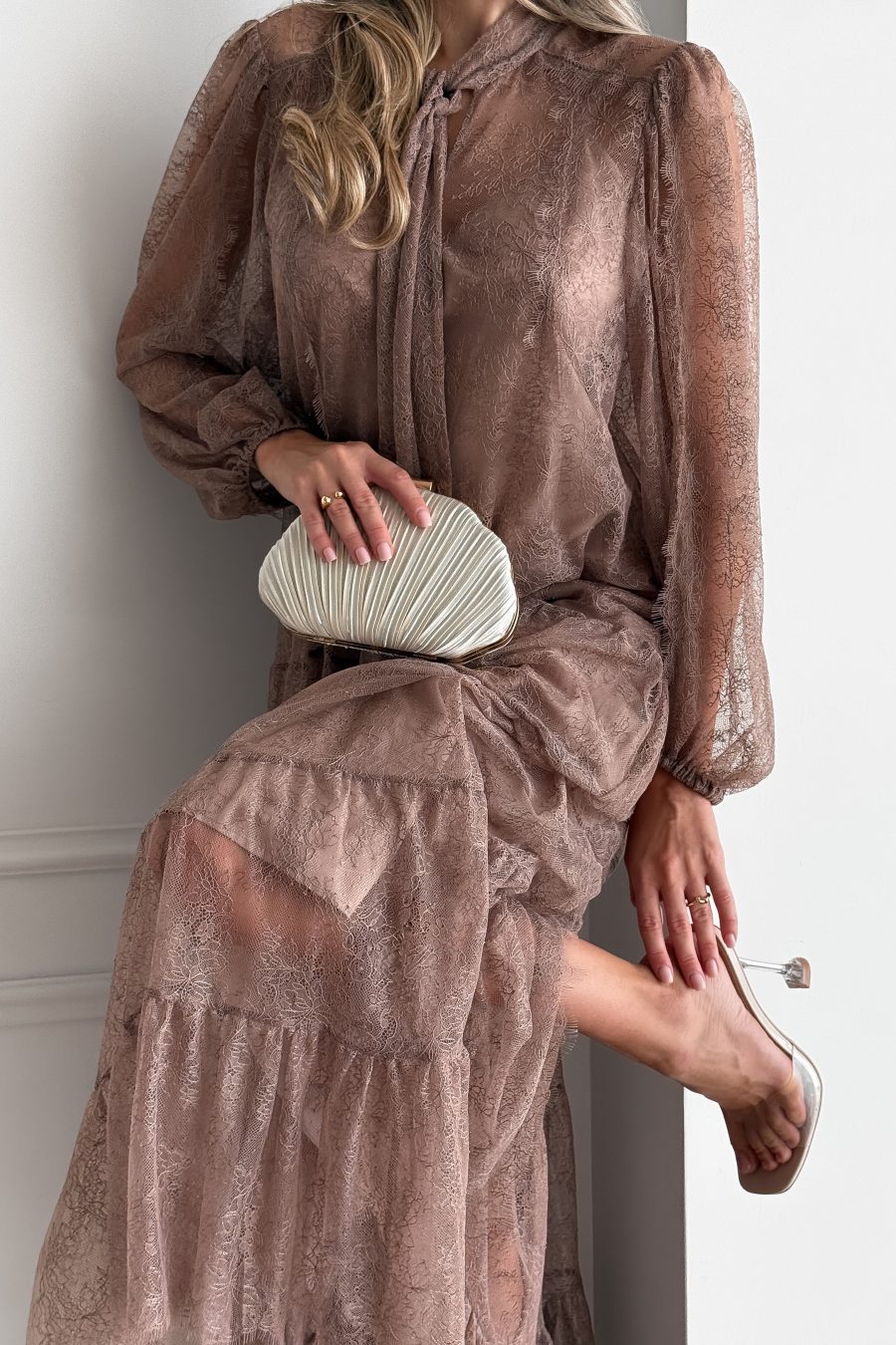 Lace long dress of a free silhouette, with a beige dress cover on straps