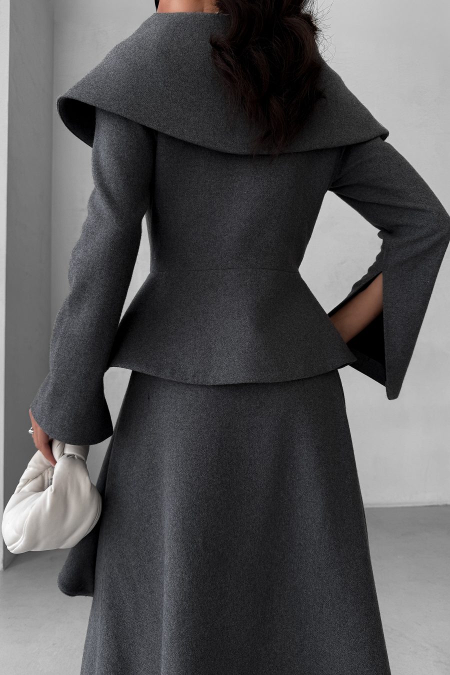 Jacket with a peplum and a wide collar made of Italian wool fabric