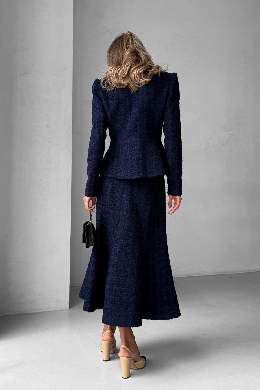 Tweed two-piece suit: asymmetrical jacket and godet skirt
