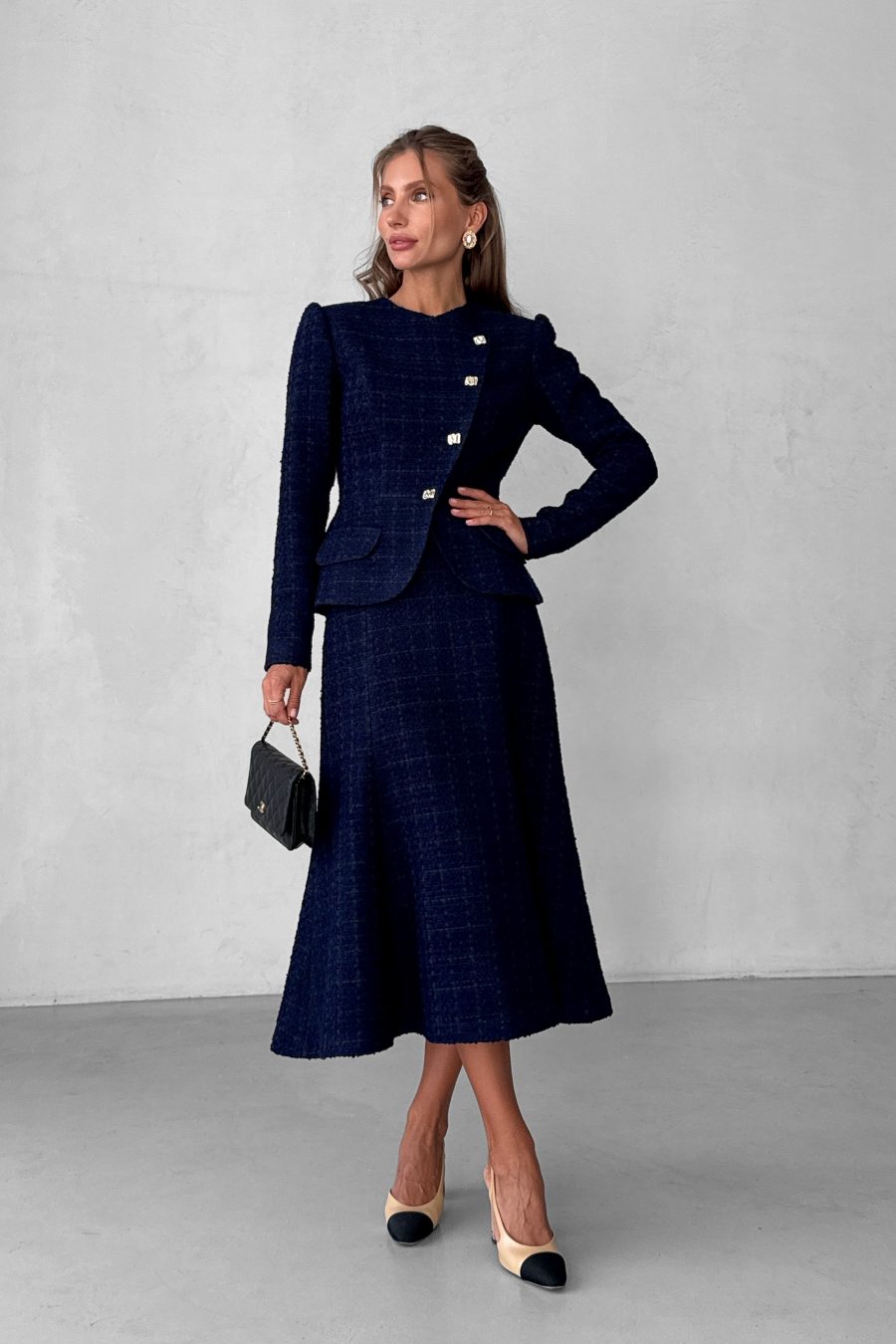 Tweed two-piece suit: asymmetrical jacket and godet skirt