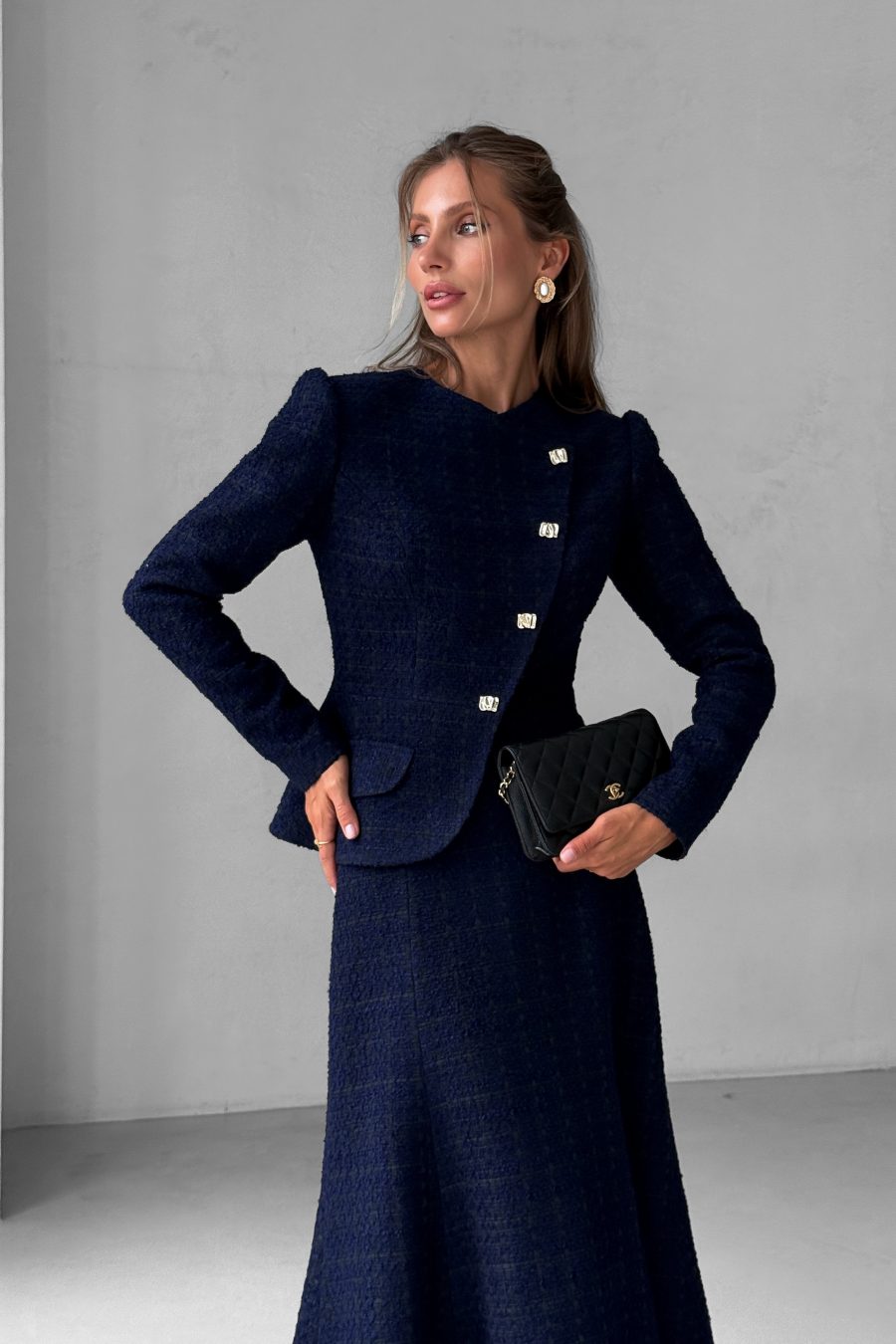 Tweed two-piece suit: asymmetrical jacket and godet skirt