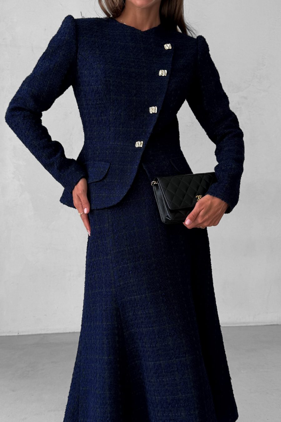Tweed two-piece suit: asymmetrical jacket and godet skirt